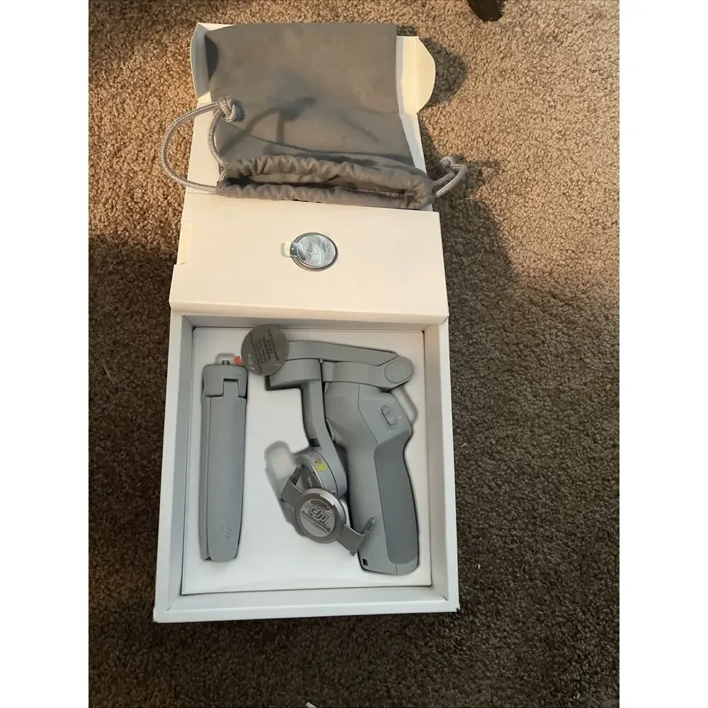 DJI OM4 3-Axis Gimbal Stabilizer / Tripod for Smartphones New